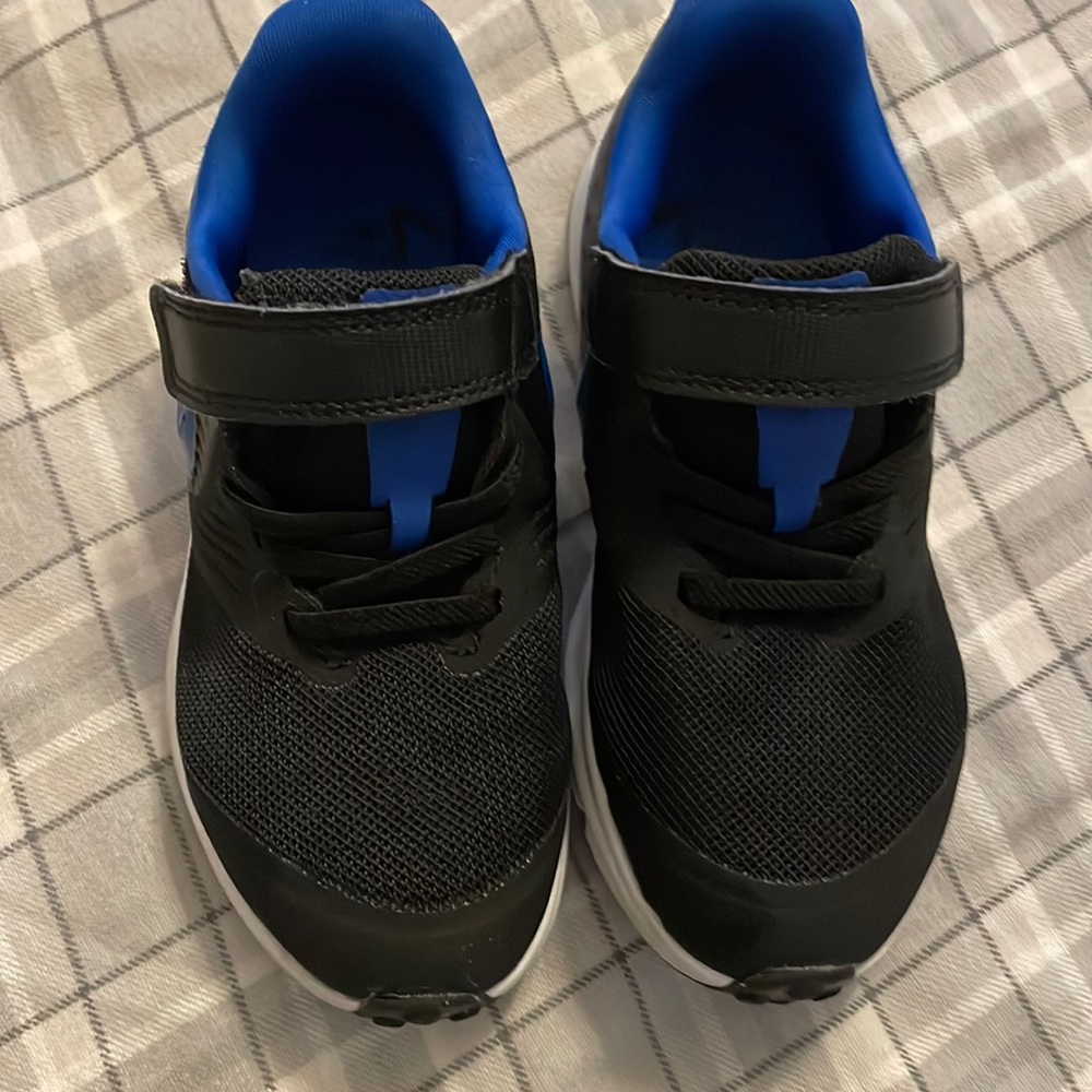 Toddler size 11c black blue Nike. Like new